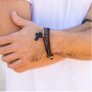 A man wearing a brown bracelet  